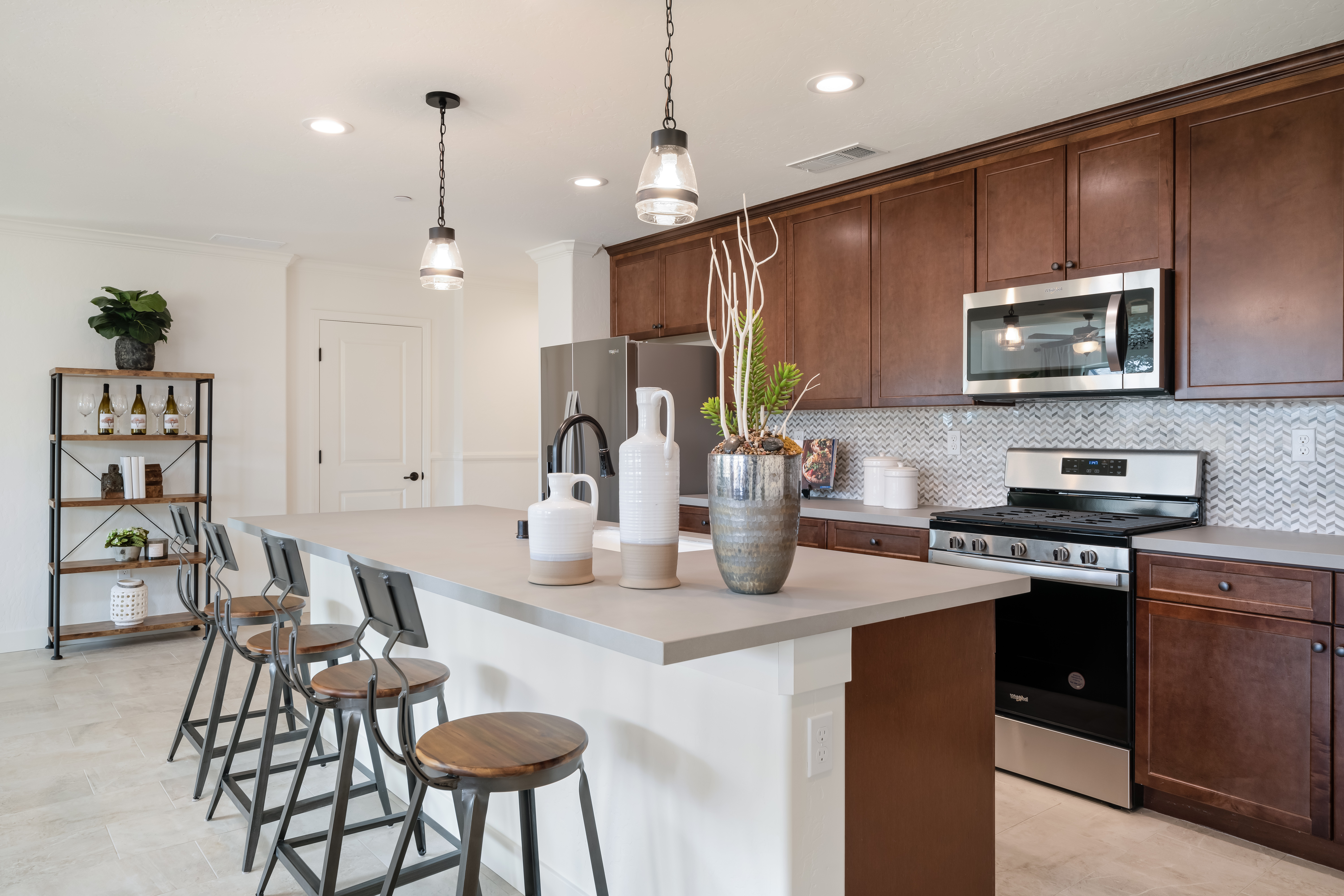 Hawthorne kitchen — warm cabinetry, herringbone backsplash